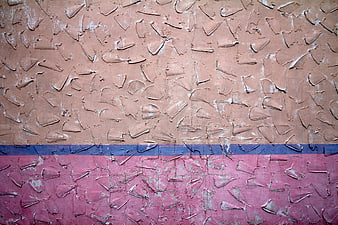 Textured Wall with Peeling Paint in Pink, Blue, and Beige