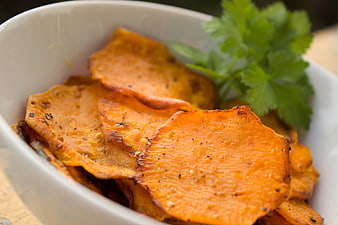 Close-up of Seasoned Sweet Potato Chips in White Bowl