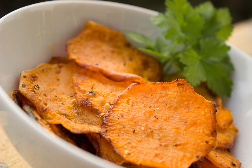 Close-up of Seasoned Sweet Potato Chips in White Bowl