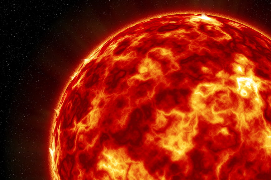 Close-up of a fiery red star surface in space