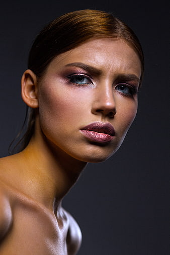 Studio beauty portrait of a woman with dramatic makeup