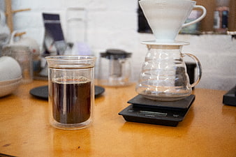 Pour over coffee brewing setup on wooden table