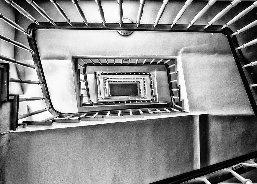 Black and white spiral staircase looking down