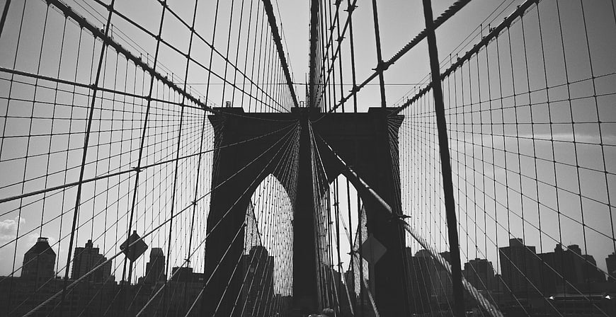 Black and white low angle view of Brooklyn Bridge cables