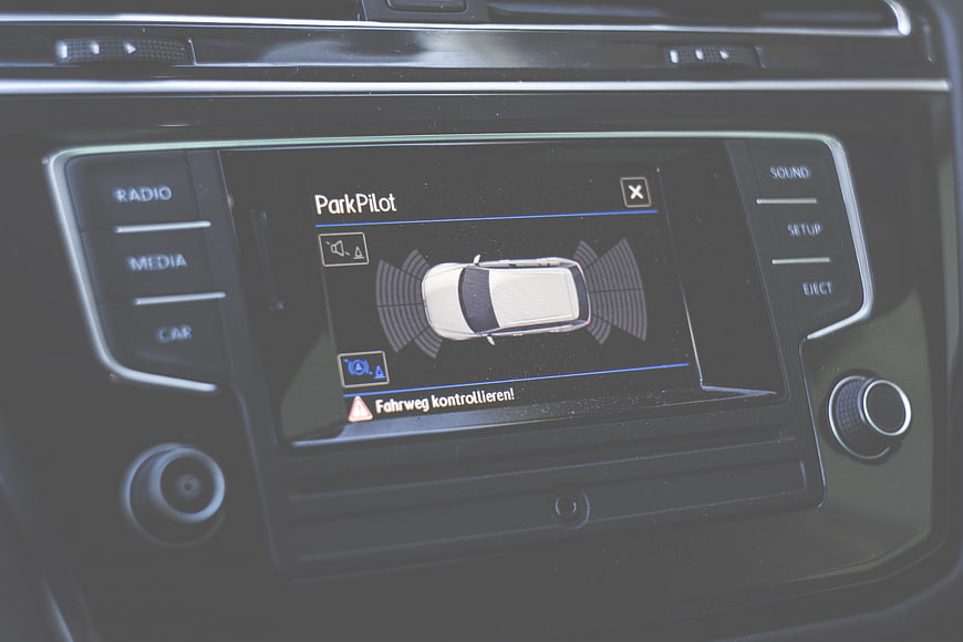 Car infotainment screen displaying ParkPilot parking assist system