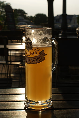 Golden Wheat Beer Mug on Outdoor Wooden Table