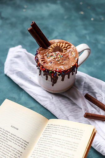 Cozy Hot Chocolate with Sprinkles and Cinnamon Sticks