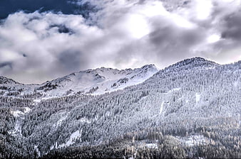 Snowy Mountain Landscape with Dramatic Clouds