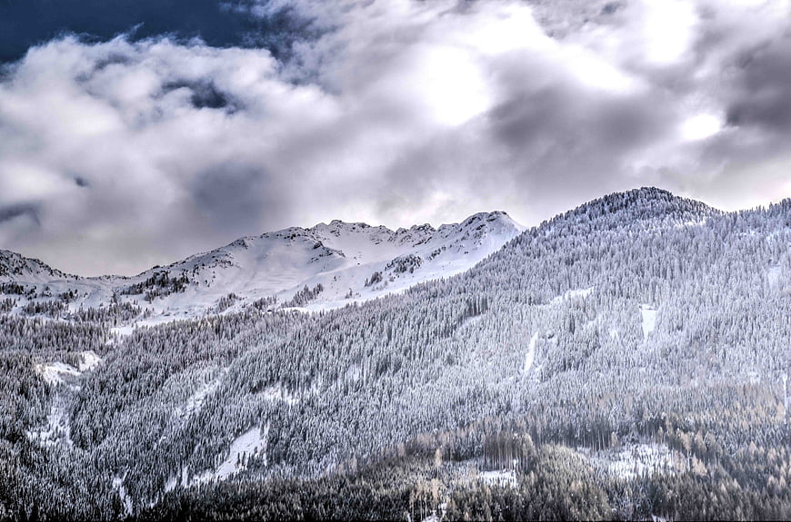 Snowy Mountain Landscape with Dramatic Clouds