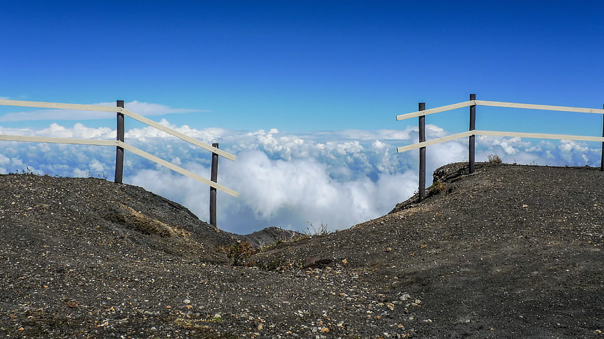 Mountain Trail with Wooden Fence Above Clouds
