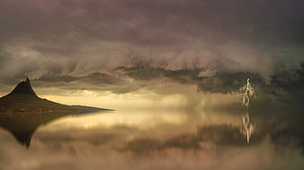 Dramatic Lightning Storm Over Mountain Lake Reflection