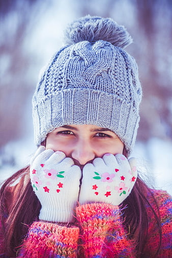 Happy Woman in Winter Hat and Gloves Smiling Outdoors