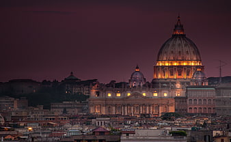 Illuminated St. Peter's Basilica Dome at Dusk in Rome