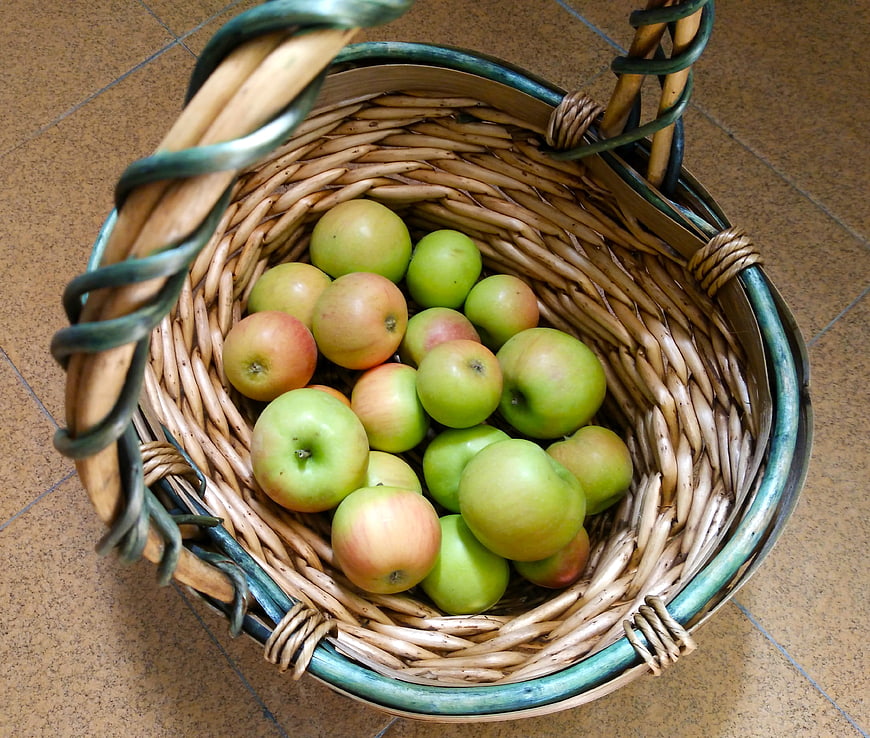 High Angle View of Green and Red Apples in Wicker Basket