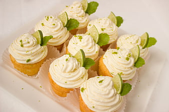 Lime and Mint Cupcakes with White Frosting on White Plate