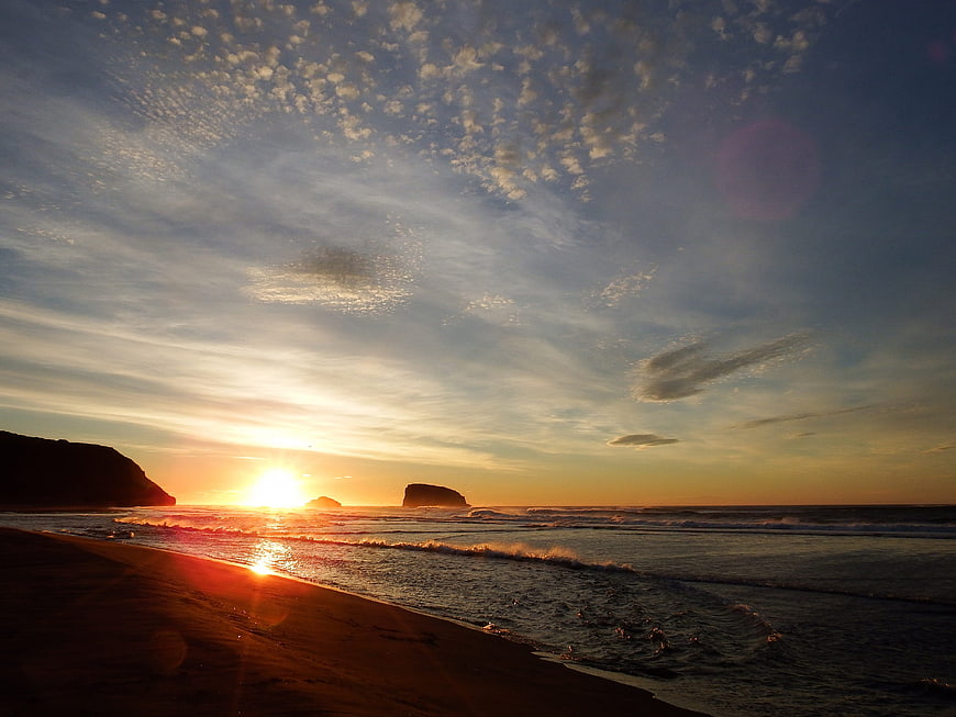 Golden Sunrise Over Pacific Ocean Beach with Sea Stacks