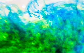 Abstract Blue and Green Ink Swirls in Water
