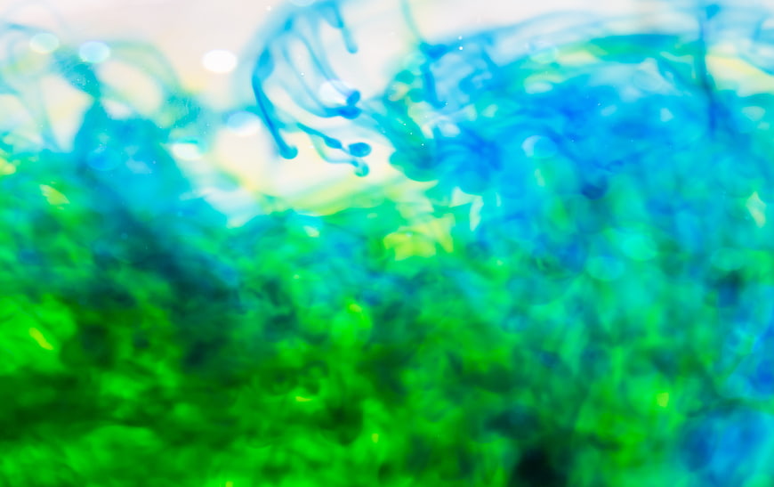 Abstract Blue and Green Ink Swirls in Water