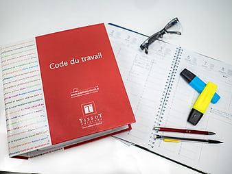 French Labor Law Book on Desk with Planner and Office Supplies