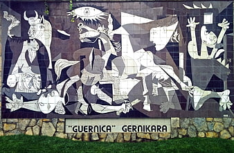 Mural of Picasso's Guernica on a stone wall with grass