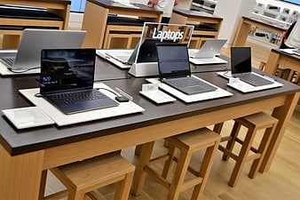 Modern Laptop Display Table in Retail Store