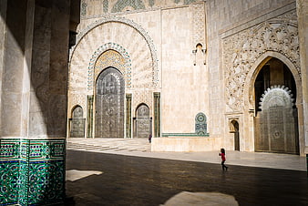 Child running in Hassan II Mosque courtyard, Morocco