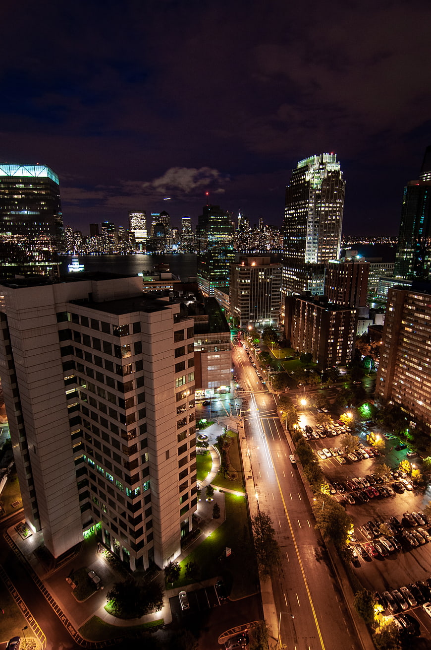 Aerial Night View of Downtown Cityscape with Light Trails