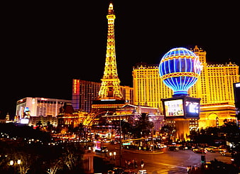 Las Vegas Strip Night Skyline With Eiffel Tower Replica And Neon Lights