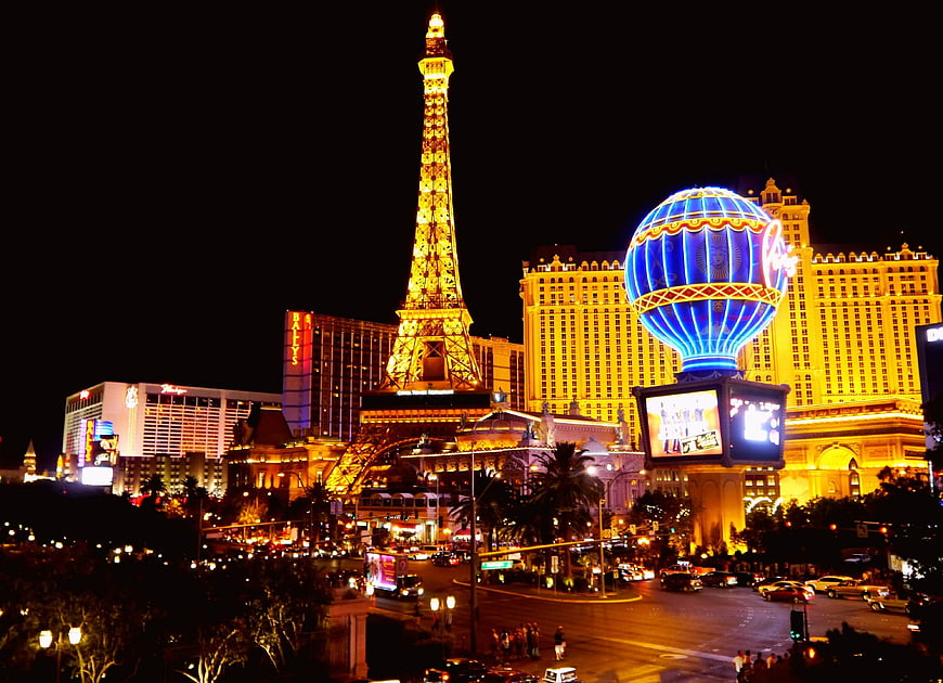 Las Vegas Strip Night Skyline With Eiffel Tower Replica And Neon Lights