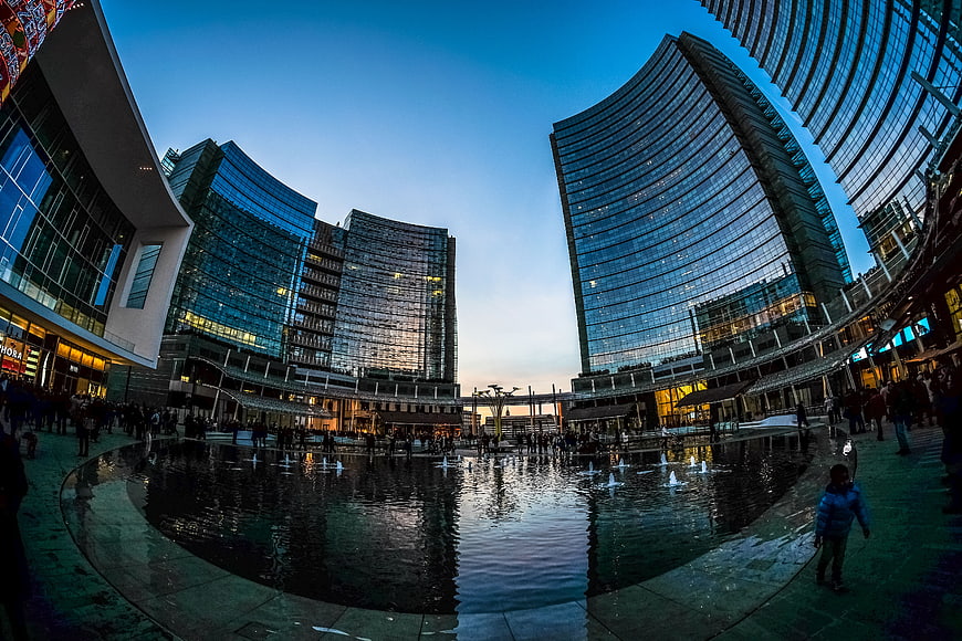 Fisheye View of Modern Skyscrapers and Fountain at Dusk