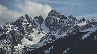 Majestic Snow-Capped Mountain Peaks with Clouds