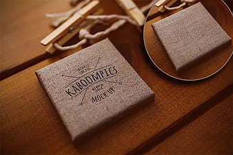 Rustic linen gift box mockup on wooden table