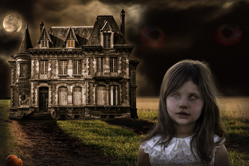 Halloween Concept: Girl with Glowing Eyes and Haunted Mansion