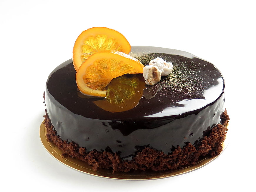 Glossy Chocolate Cake with Dried Orange Slices and Hazelnuts