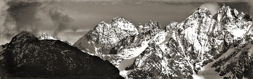 Dramatic Black and White Snowy Mountain Peaks Panorama