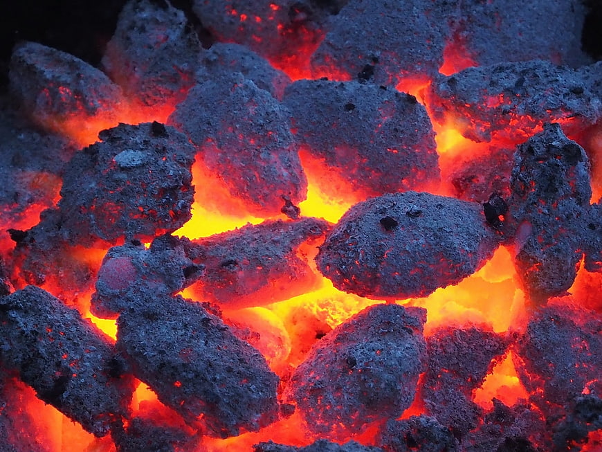 Glowing charcoal embers for grilling and barbecue