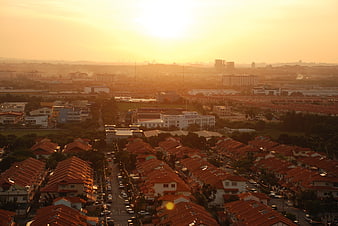 Golden hour aerial view of suburban residential neighborhood