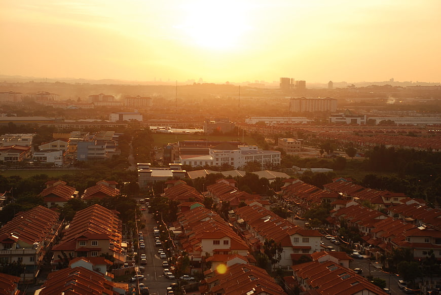 Golden hour aerial view of suburban residential neighborhood