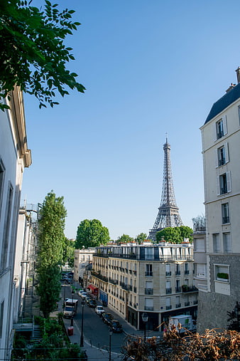 Paris street view with Eiffel Tower in distance