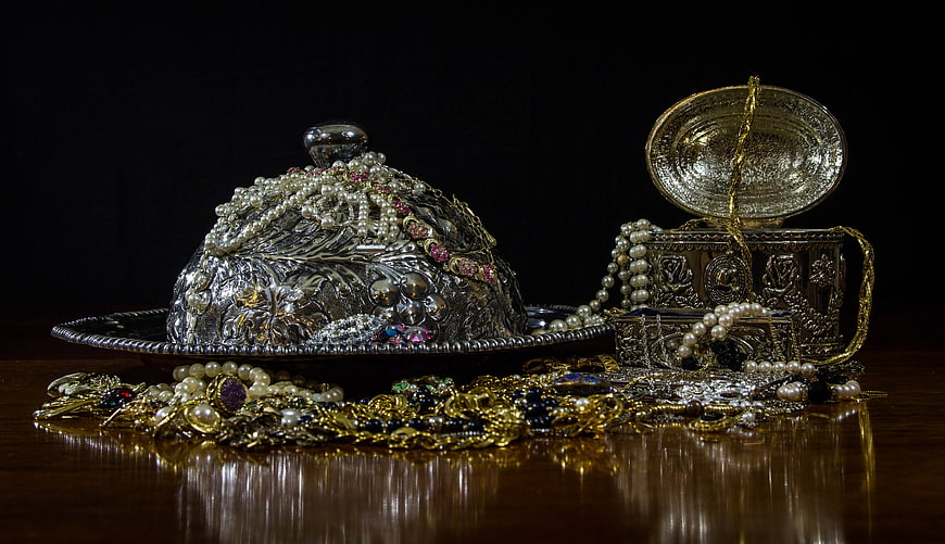 Luxurious antique silver and gold jewelry collection with pearls and gems