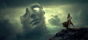 Surreal fantasy woman standing on cliff near giant stone mask