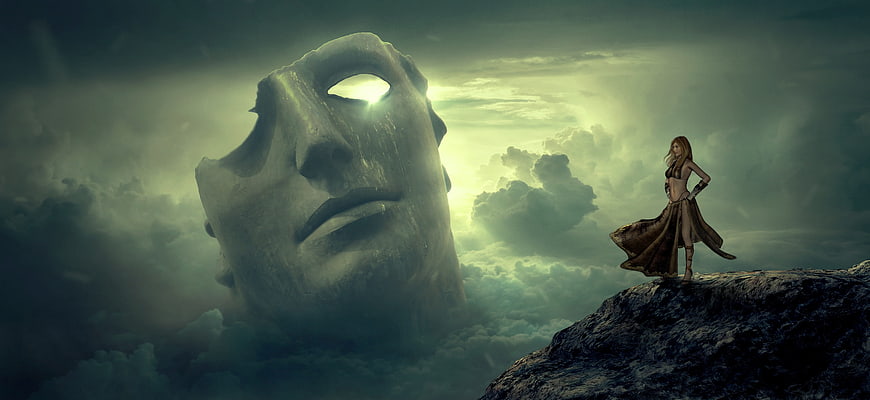 Surreal fantasy woman standing on cliff near giant stone mask