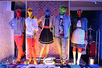 Colorful Mannequins In Fashion Store Window Display