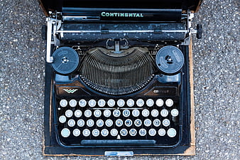 Vintage Continental Portable Typewriter On Gravel Surface