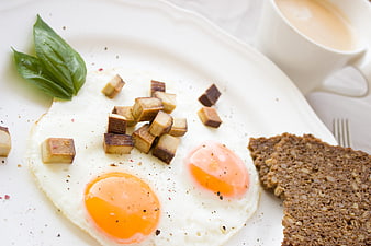 Healthy Breakfast with Fried Eggs, Tofu, and Dark Rye Bread