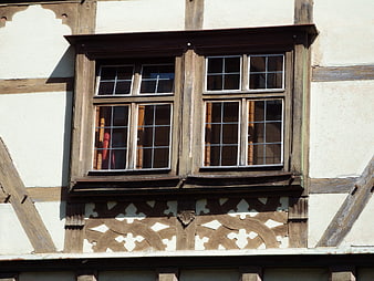 Detail of a historic half-timbered house window in Bavaria