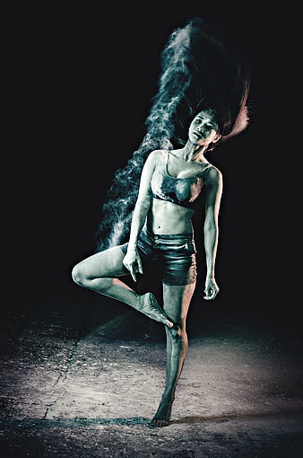 Woman in Tree Pose with Blue Powder Explosion