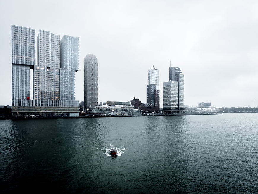 Modern City Skyline with Skyscrapers and Boat on Water