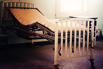Abandoned Hospital Bed In Old Room