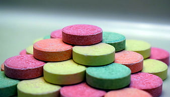 Colorful Chewable Tablets Stacked In A Pyramid Shape